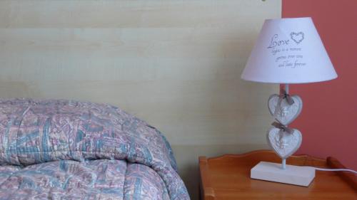 Postel nebo postele na pokoji v ubytování Romantico B&B