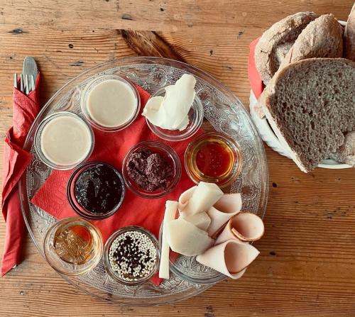 a plate of food with bread and other ingredients on a table at ISSA Lesvos in Mytilini