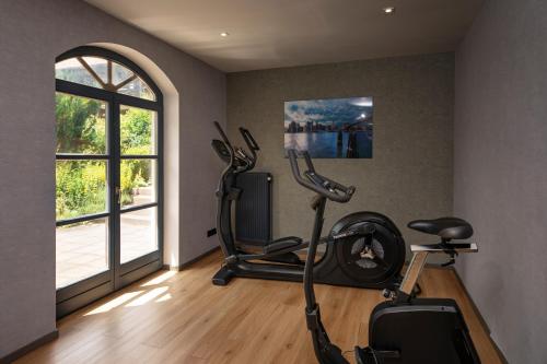 a gym with two exercise bikes and a window at Hotel am Badepark Waldkirchen in Waldkirchen