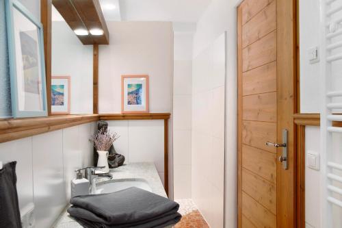 a bathroom with a sink and a mirror at Bergnest Penning in Hopfgarten im Brixental