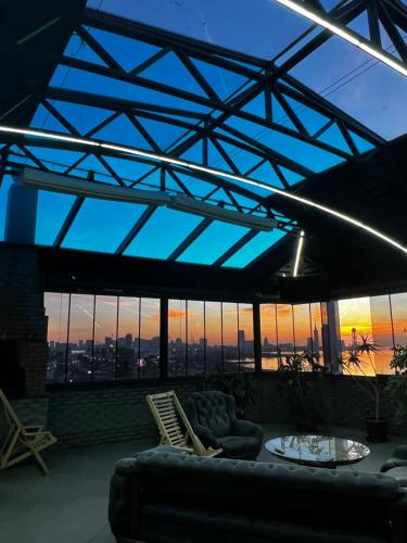 a living room with a view of the city at BST Holiday in Batumi