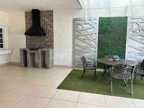 Ein Sitzbereich in der Unterkunft Espaciosa Casa Enorme Cochera Asador y Futbolito