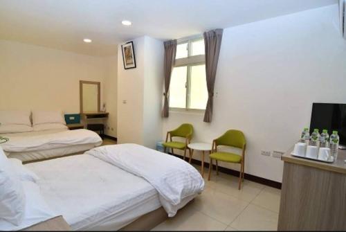 Postel nebo postele na pokoji v ubytování Xiangbin B&B
