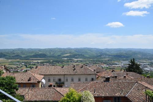 a view of a village with roofs at An tij slè - Nel cuore del borgo in Guarene