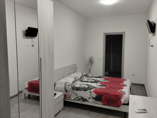 Ένα ή περισσότερα κρεβάτια σε δωμάτιο στο Casa vacanza Fabrizio San Teodoro