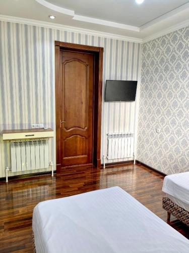 Ένα ή περισσότερα κρεβάτια σε δωμάτιο στο Hayati HOTEL