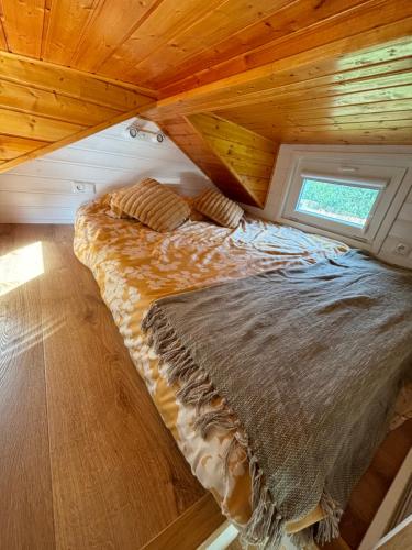 Postel nebo postele na pokoji v ubytování Prullenbos Tiny Nutz Nest