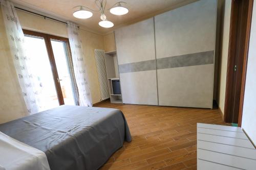 Ένα ή περισσότερα κρεβάτια σε δωμάτιο στο Bed and Breakfast a casa di Valerio