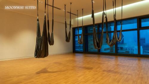 an empty room with umbrellas hanging from the ceiling at MOONWAY SUITES At EATON KLCC in Kuala Lumpur