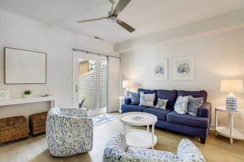 a living room with a blue couch and chairs at Walk to Shore and Boardwalk Bethany Beach Retreat in Bethany Beach