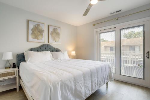 a white bedroom with a large bed and a window at Walk to Shore and Boardwalk Bethany Beach Retreat in Bethany Beach