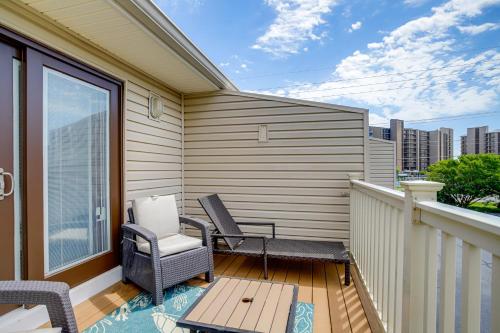 a balcony with two chairs and a table at Walk to Shore and Boardwalk Bethany Beach Retreat in Bethany Beach