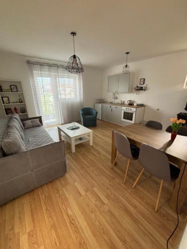 a living room with a couch and a table at Apartman Zlatija in Bajina Bašta