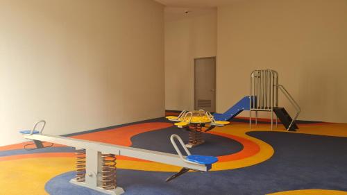 a play room with a table and a playground at MOONWAY SUITES At EATON KLCC in Kuala Lumpur