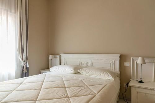 Ένα ή περισσότερα κρεβάτια σε δωμάτιο στο Beauty Case intimate, quiet and central apartment