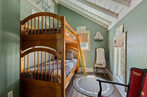 a bedroom with a bunk bed and a ladder at The Fourth Oak in Three Oaks