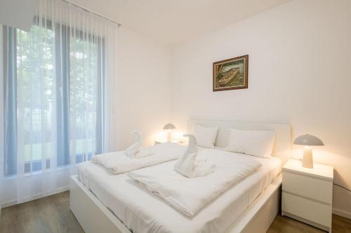 Posteľ alebo postele v izbe v ubytovaní Haven Apartman Zamárdi By BLTN