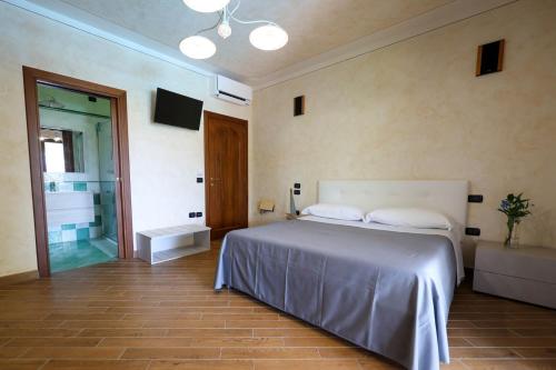 Postel nebo postele na pokoji v ubytování Bed and Breakfast a casa di Valerio
