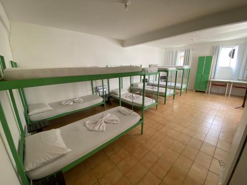 a group of bunk beds in a room at Hostel e Pousada Barra da Tijuca in Rio de Janeiro