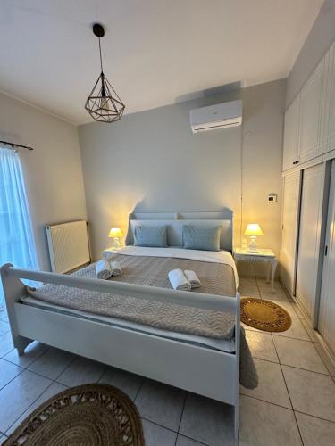 a bedroom with a large bed in a room at Apartment beach house in Chalkida