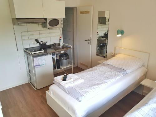 Η κουζίνα ή μικρή κουζίνα στο Aparthotel Jonas
