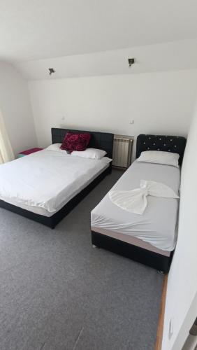 Ein Bett oder Betten in einem Zimmer der Unterkunft Vila AMNA - Ilidža