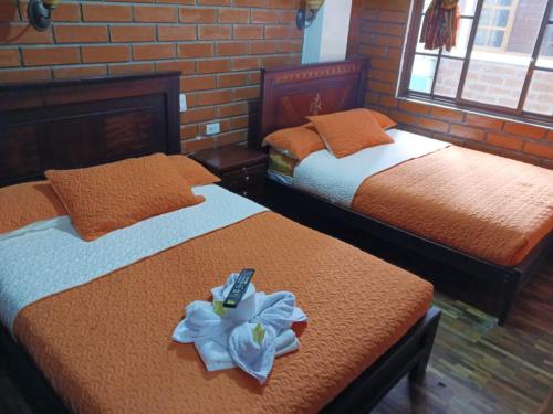 Postel nebo postele na pokoji v ubytování Hostal Nomada