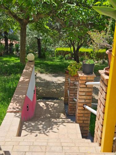 a park with a skateboard ramp in a yard at Case Vacanze Macchione in Capo Vaticano