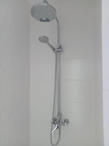 a shower with a shower head in a bathroom at Nunoli Duplex Luxury Playa Blanca in Playa Blanca