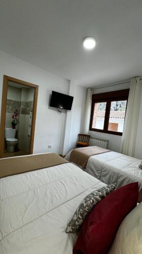 Postel nebo postele na pokoji v ubytování Casa rural Gerardo