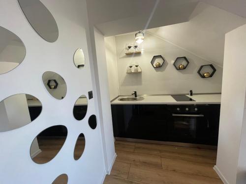 a small kitchen with a sink and a counter at Goldy in Neum