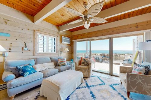 a living room with a couch and a ceiling fan at Caravelle 1 in Ocean City
