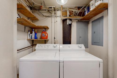 a laundry room with a white washer and dryer at Caravelle 1 in Ocean City
