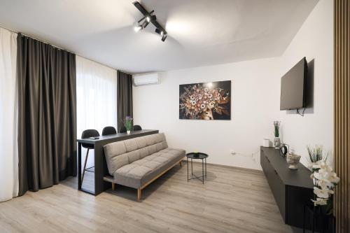 a living room with a couch and a table at Classy apartments in city centar in Zadar