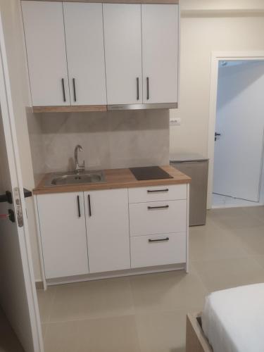 Кухня или мини-кухня в Lukova Center Apartments
