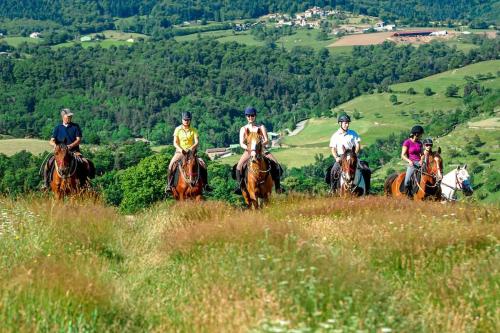 a group of people riding horses on a hill at Villa L'Olivier in Vallon-Pont-dʼArc