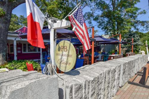 a wall with an american flag and a restaurant at Unique waterfront home with stunning views in Wellfleet