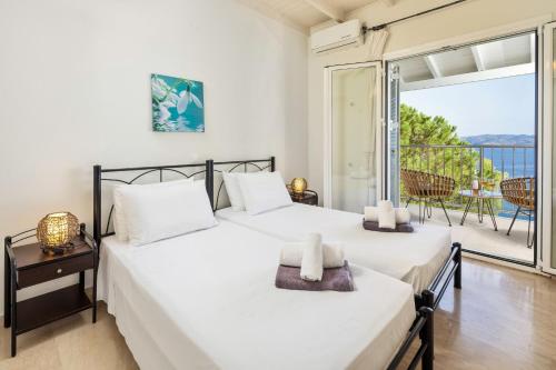 Ένα ή περισσότερα κρεβάτια σε δωμάτιο στο Villa Anastar