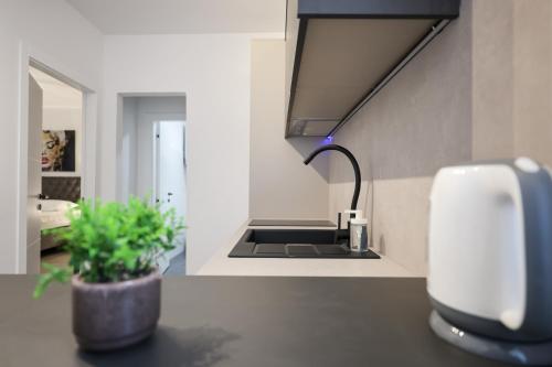 a kitchen with a sink with a faucet at Classy apartments in city centar in Zadar