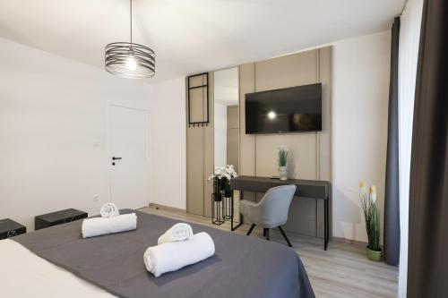 a room with two white towels on a table at Classy apartments in city centar in Zadar