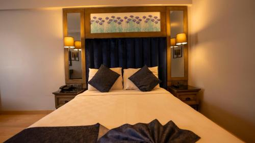 Una cama o camas en una habitación de Farina Hotel By Cigno