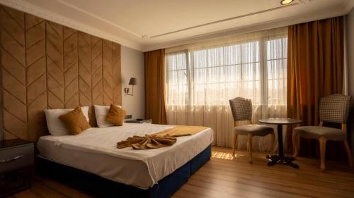 Postel nebo postele na pokoji v ubytování Farina Hotel By Cigno