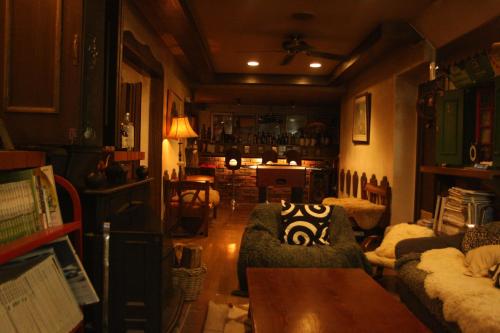 a living room with a couch and a table at Grandpapa in Kutchan