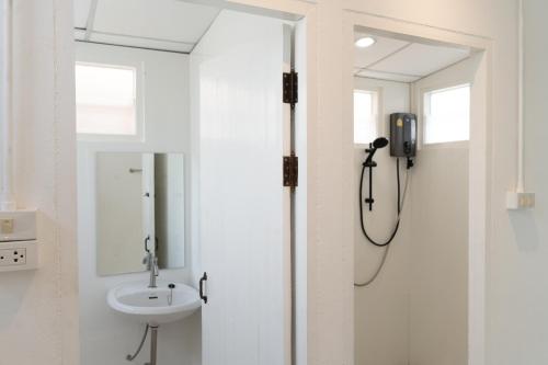 a bathroom with a shower and a sink at Chiang Mai Mansion 2 in Chiang Mai