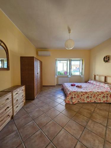 Кровать или кровати в номере Bebo house Fiumicino
