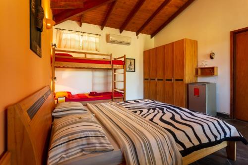 Cama o camas de una habitación en Mbuni Granja de Avestruz