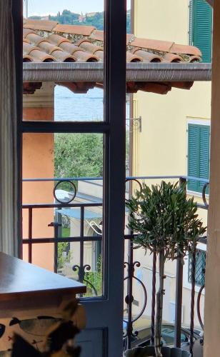 a view of a balcony with a table and a window at Acquadolce in Salò