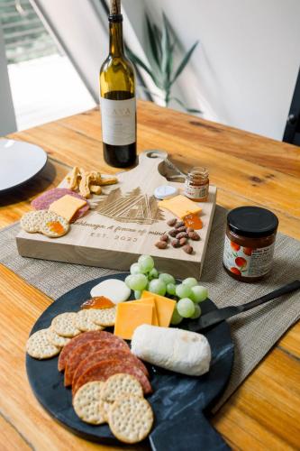 a plate of cheese and meats and a bottle of wine at A Frame of Mind in Dahlonega