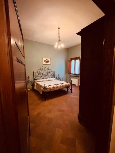 a bedroom with a large bed in a room at La Torre wine resort in Montecarlo