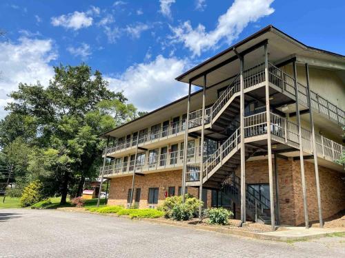 a brick building with balconies on the side of it at Hillside Lodge in Lake Junaluska